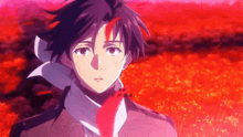 a man with a scarf around his neck is standing in a field with red flowers .