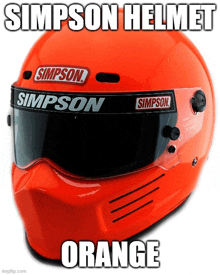 an orange simpson helmet with a visor