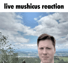 a man is standing in front of a cloudy sky with the words live mushicus reaction above him