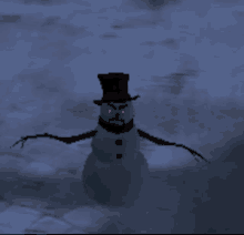 a snowman with red eyes and a top hat stands in the snow