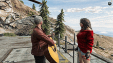 a man playing a guitar to a woman in a red sweater