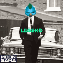 a man in a suit and tie is standing in front of a car with the word legend on it