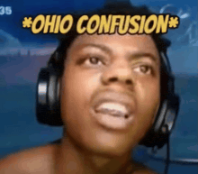 a man wearing headphones is making a funny face with the words `` ohio confusion '' above his head .