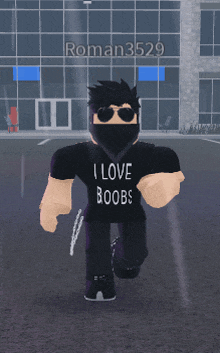 a man wearing sunglasses and a black shirt that says i love boobs