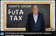 a man in a suit stands in front of a chalkboard that says today 's lesson futa tax