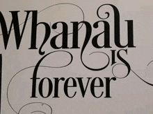 a sign that says " whanu is forever " on a white background