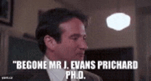 a man in a suit and tie is talking about becoming mr. j. evans prichard ph.d. .