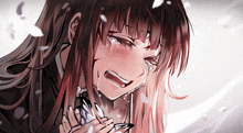 a girl with long red hair is crying and holding a glass