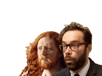 a man with glasses stands next to another man with long red hair