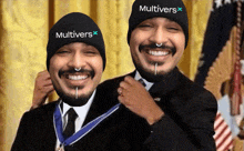 two men wearing hats that say multivers on them