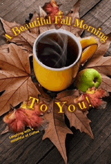 a cup of coffee is surrounded by autumn leaves and an apple and says a beautiful fall morning to you