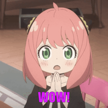 a girl with pink hair and green eyes has the word wow on her chest