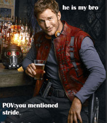 a man in a red leather vest is holding a glass of beer with the caption he is my bro