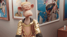 a monkey in a gold outfit is sitting in front of a wall with paintings on it