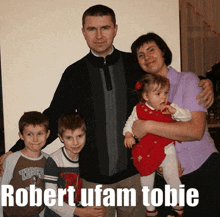 a family posing for a picture with the words robert ufam tobie at the top