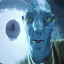 a man with a blue face and yellow eyes is looking at a doughnut .