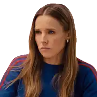 a woman with long hair wearing a blue sweater