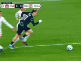 a soccer game between canada and tunisia with a score of 0 to 0