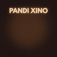 a panda bear sitting on top of a cookie with the words " panda xine " below it