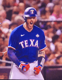 a baseball player for the texas rangers celebrates his home run