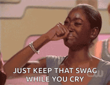 a woman crying with the words just keep that swag while you cry on the bottom