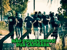 a group of people walking down a street with the words rua cambada written on the bottom