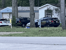 a sheriff 's vehicle is parked on the side of the road