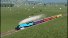 a blue and purple train going through a field