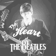 a black and white photo of a man playing a guitar with the words " the heart of the beatles " below him