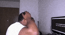 a man sitting in front of a computer screen that says a world premiere event next saturday sept