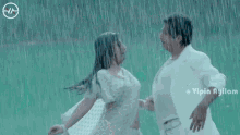 a man touches a woman 's face in the rain with a watermark that says ' vipin ayilam ' on it