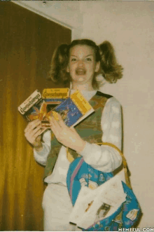 a girl holding a book called goosebumps