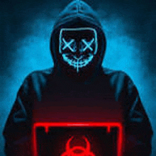 a person wearing a neon mask is holding a laptop computer .