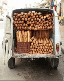 a white van filled with lots of bread