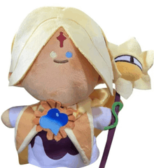 a stuffed doll with a cross on its face