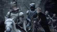 a group of people riding horses with the word hbo in the corner