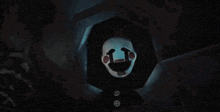 a close up of a puppet with a blue light coming out of it 's mouth .