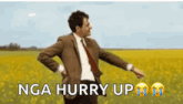 mr bean is dancing in a field of yellow flowers .