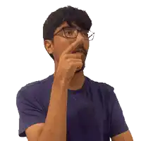 a man with glasses and a beard is pointing his finger