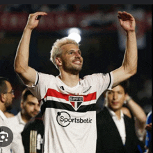 a soccer player wearing a jersey that says sportsbetic on it