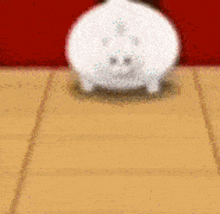 a white piggy bank is sitting on a tan tile floor .