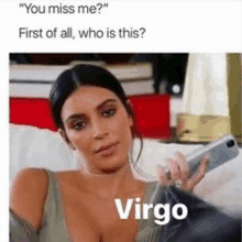 a woman is sitting on a couch holding a cell phone and a meme about virgo .