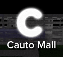 a large white letter c is glowing in the dark above the words cauto mall