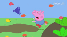 peppa pig is standing on a dirt road in a field .