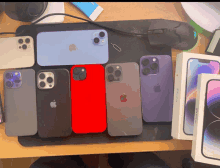 a bunch of apple iphones are laying on a desk