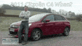 a man stands in front of a red citroen c4 with the words 2011 citroen c4 when written above him