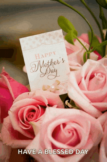 a bouquet of pink roses with a happy mother 's day card on top