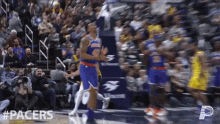 a basketball game is being played with #pacers written on the bottom