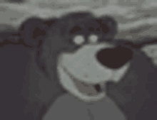 a close up of a cartoon dog with its mouth open .