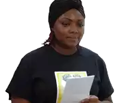 a woman wearing a turban is reading a letter